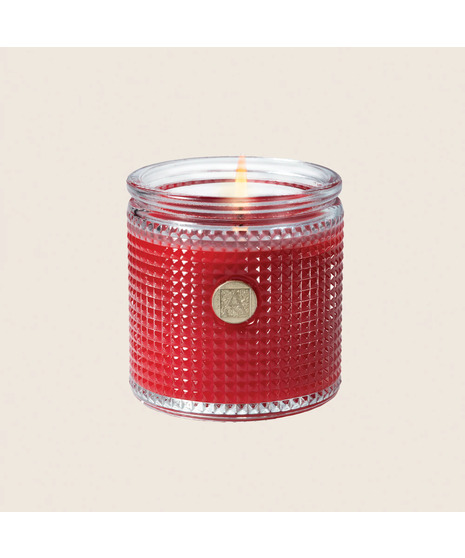 colored aromatic candle on a neutral white background